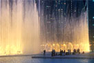 Vibrant atmosphere at Dubai Fountain boardwalk with iconic Burj Khalifa as the backdrop
