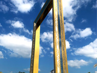 Dubai Frame's golden facade against a blue sky