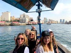 Tourists on an abra water taxi in Old Dubai