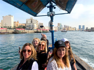 Tourists on an abra water taxi in Old Dubai