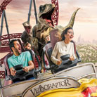 Couple experiencing the high-speed thrills of the Velociraptor rollercoaster at IMG Worlds of Adventure