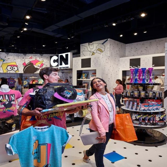 A couple enjoying shopping at the Cartoon Network store within IMG Worlds of Adventur