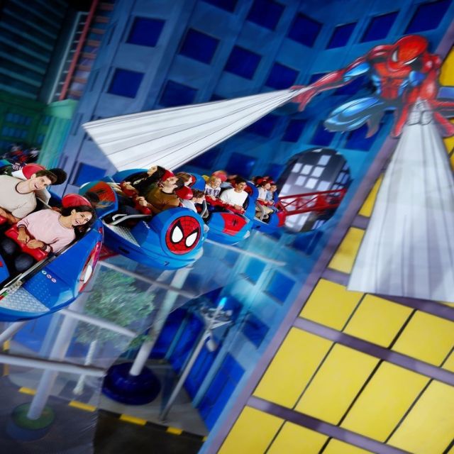 A family and couple experiencing the excitement of Spider-Man Doc Ock's Revenge at IMG Worlds of Adventure