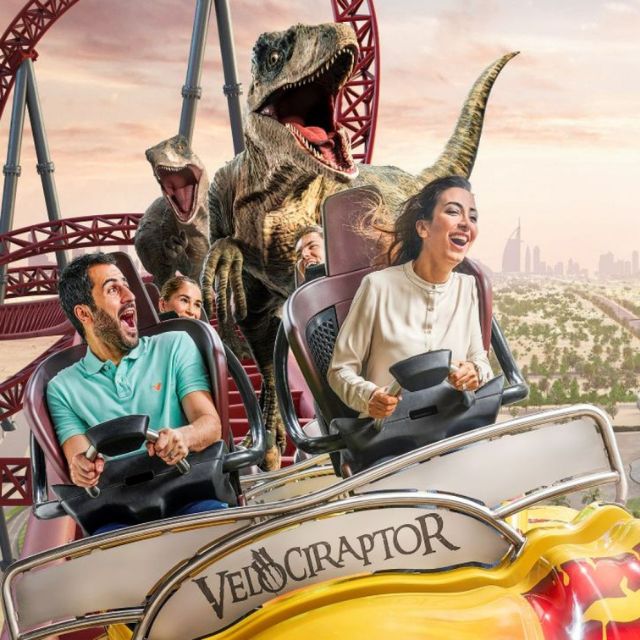 Couple experiencing the high-speed thrills of the Velociraptor rollercoaster at IMG Worlds of Adventure