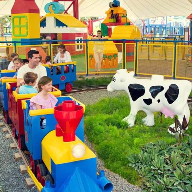 Excited children experiencing the joy of the Duplo Express ride at LEGOLAND Dubai