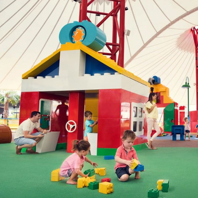 Young children engaging in imaginative play and building with LEGO bricks at Duplo Valley, LEGOLAND Dubai