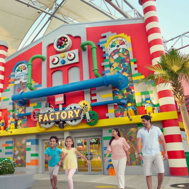 Excited family exploring the LEGO factory and learning about the production process