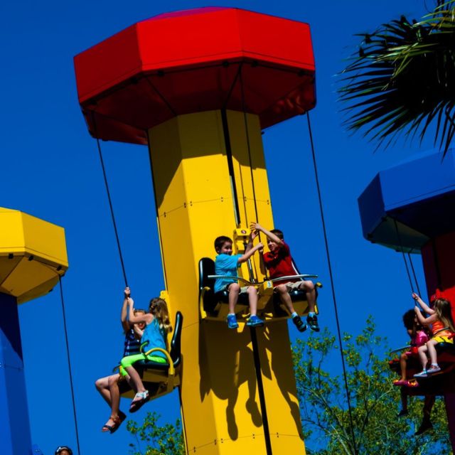 Excited kids experiencing the joy of the Kid Power Tower at LEGOLAND Dubai