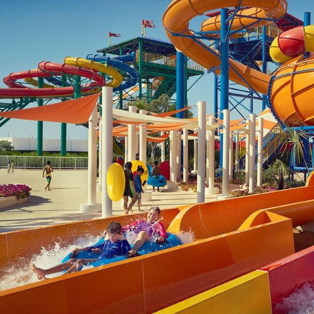 Excited kids splashing down water slides at LEGOLAND Water Park
