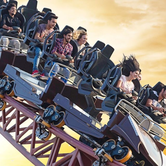 Thrill-seeker experiencing the high-speed twists and turns of the Hunger Games Capitol Bullet Train ride at Motiongate Dubai