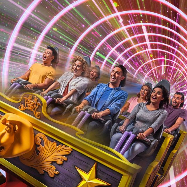 Thrill-seeking adults experiencing the adrenaline-pumping Madagascar Mad Pursuit ride at Motiongate Dubai