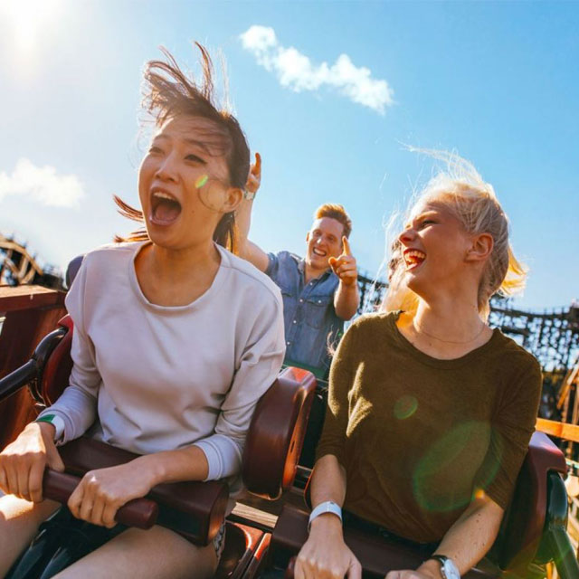 High-speed fun: Female duo on the Hala Madrid coaster at Real Madrid World