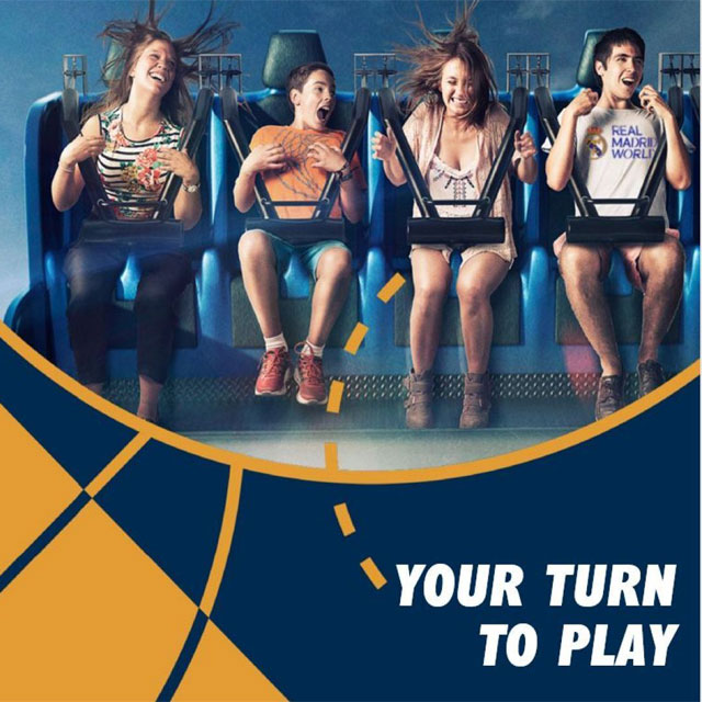 Thrill-seeking friends on a high-octane mini drop tower at Real Madrid World