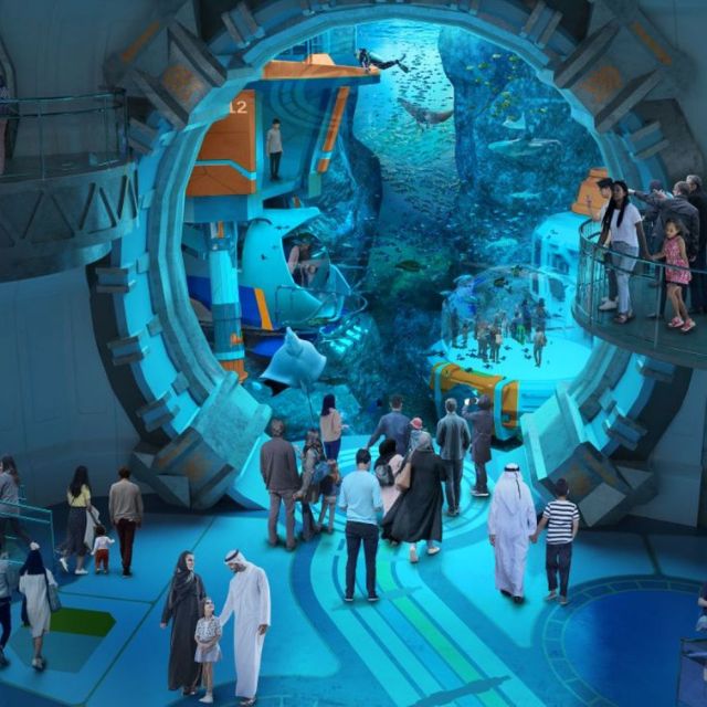 Awe-inspiring view of marine life through a massive submarine-like window at the Endless Ocean realm in SeaWorld Abu Dhabi