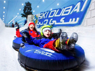 Mother and son on a tube ride at Ski Dubai