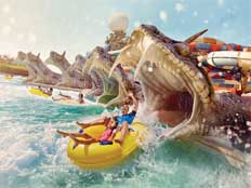 Father and daughter on a water slide at Yas Waterworld