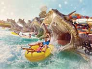 Father and daughter on a water slide at Yas Waterworld