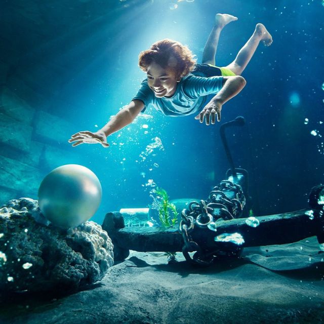 Underwater adventure: Boy exploring the depths at Yas Waterworld Abu Dhabi